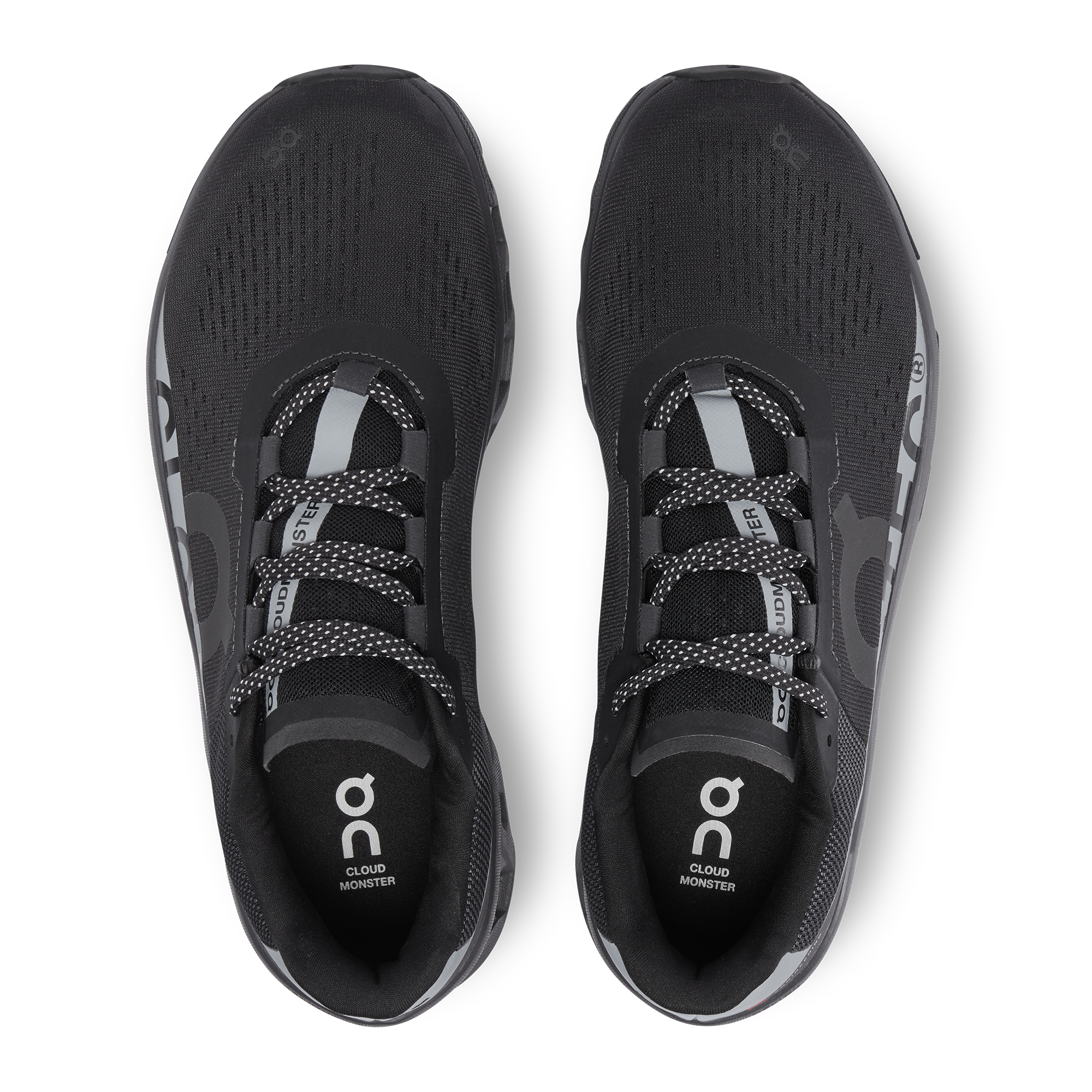 The black Cloudmonster Lumos with expressive, reflective graphics, shot from above.
