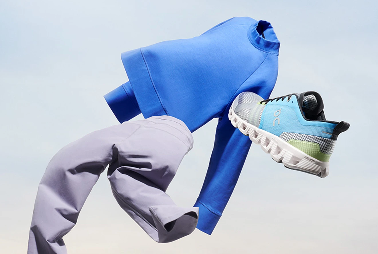 Flying product shot of the blue Crew Neck and blue and green Cloud X. 